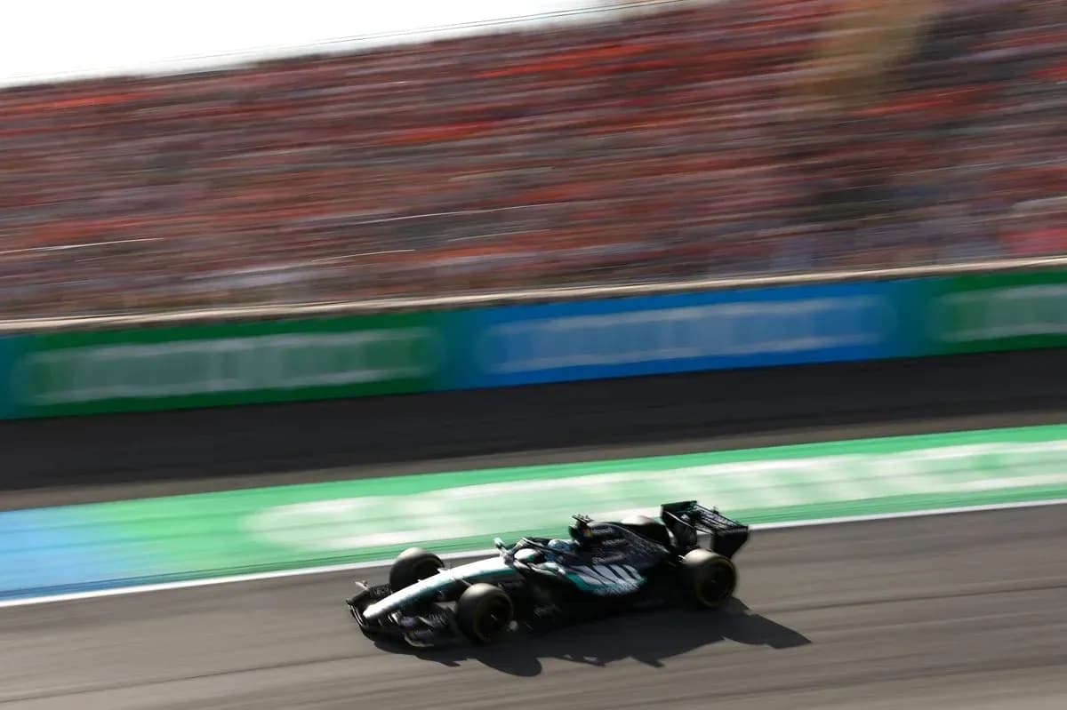Formula 1 car racing on track with blurred background