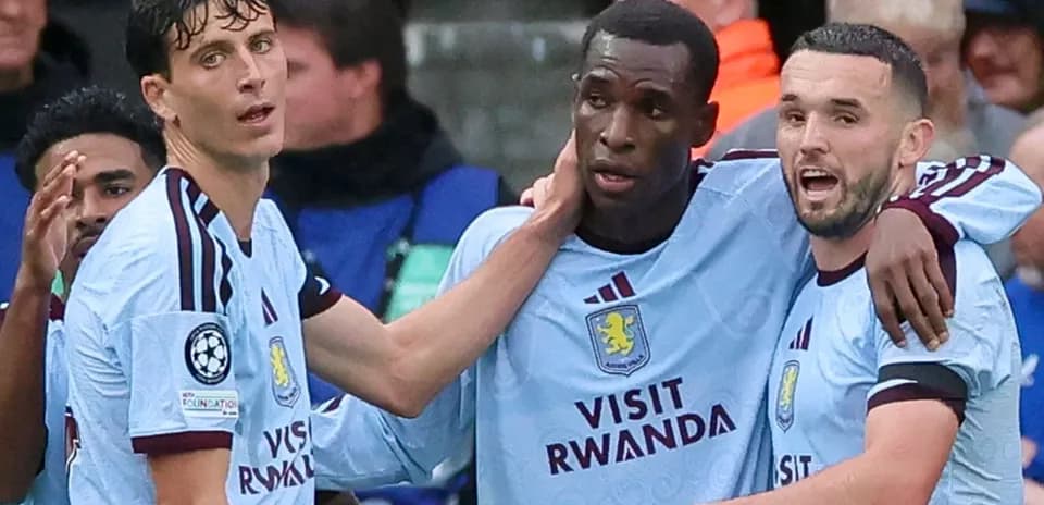 Aston Villa players celebrating a goal together