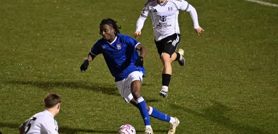 Ipswich player dribbling past Fulham opponent