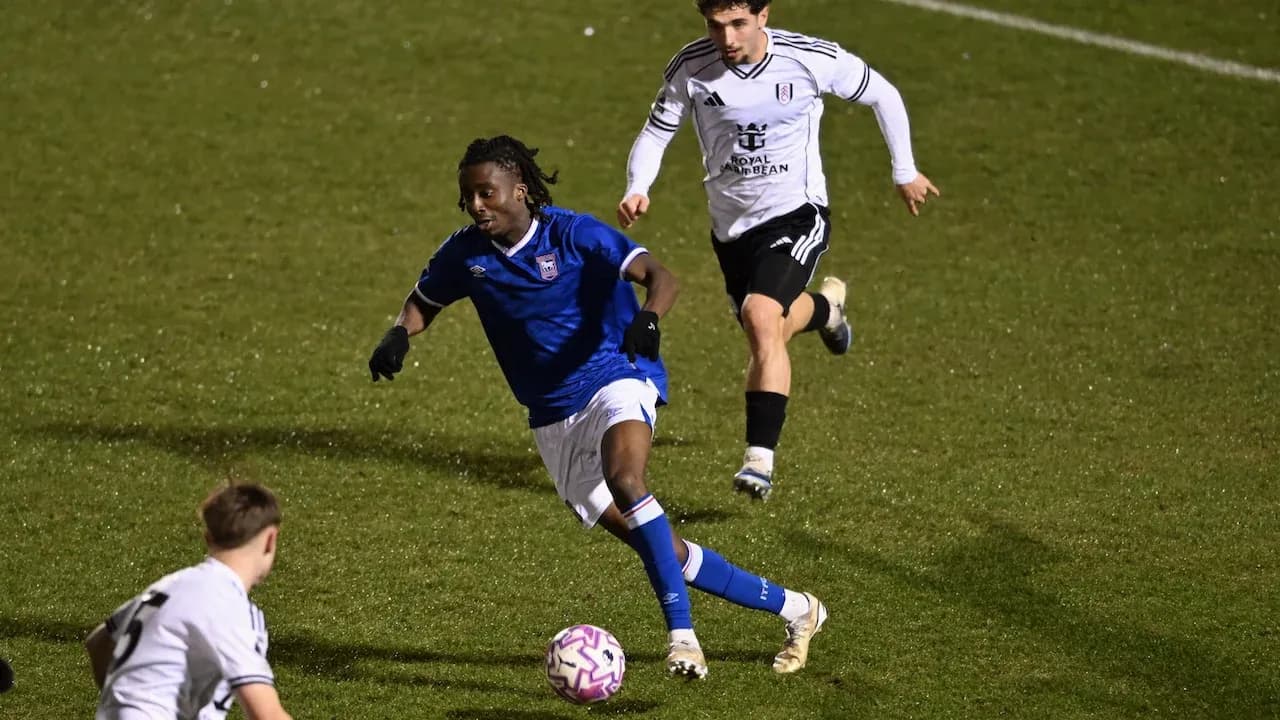 Ipswich player dribbling past Fulham opponent