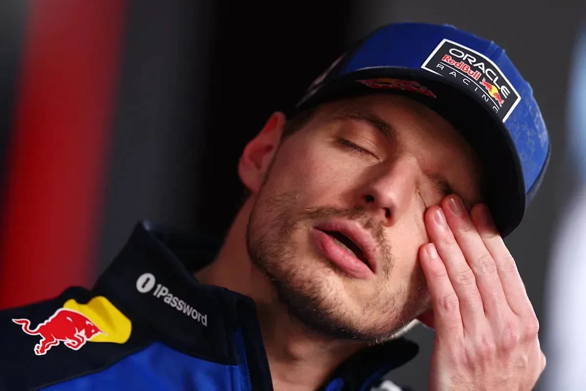 Driver resting during a press conference appearance