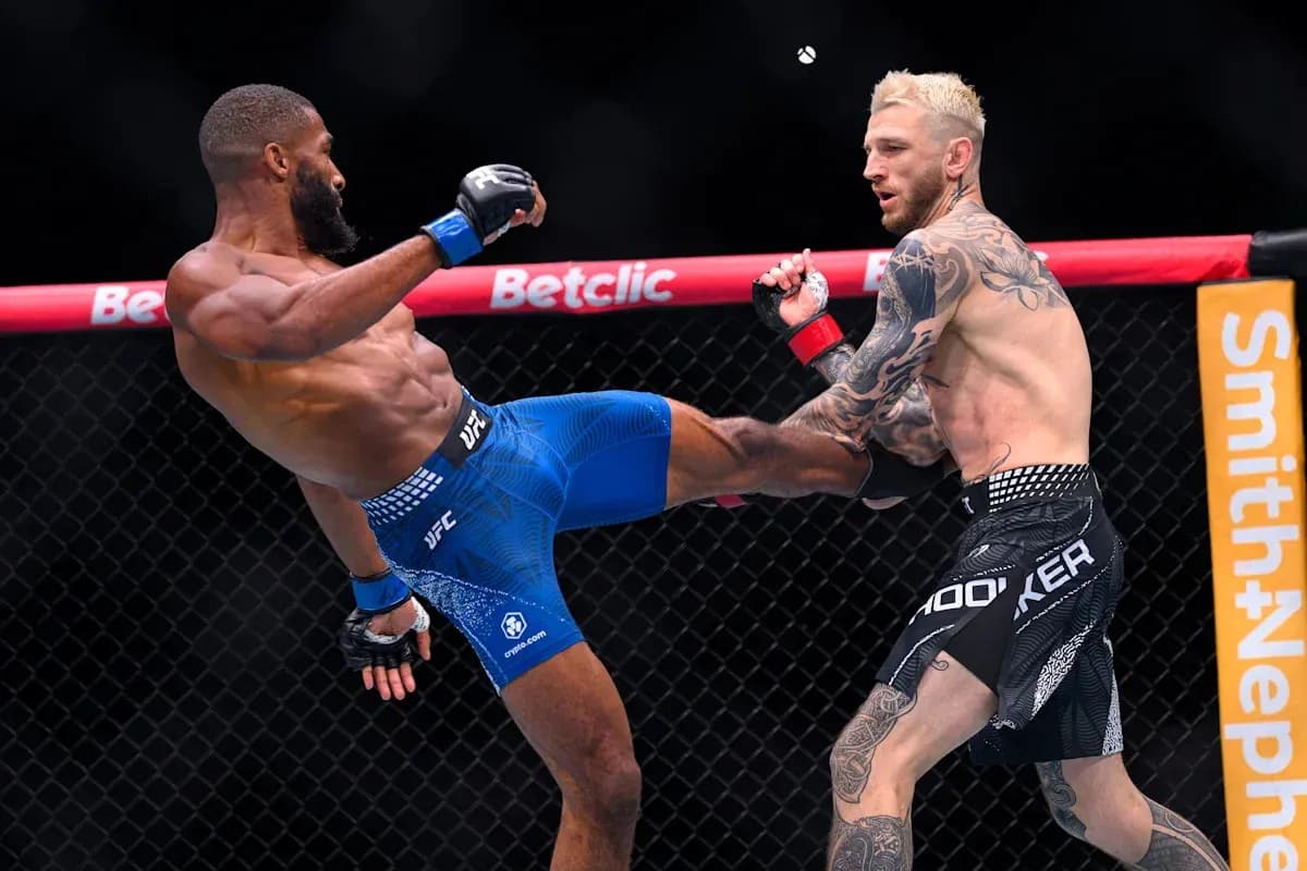 Two fighters engaged in an MMA match in octagon