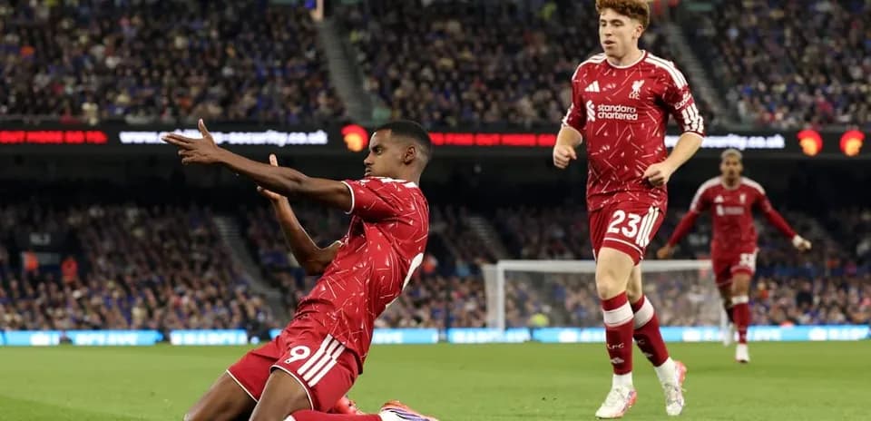 Liverpool players celebrating on the pitch during match
