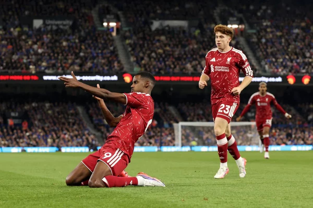 Liverpool players celebrating on the pitch during match
