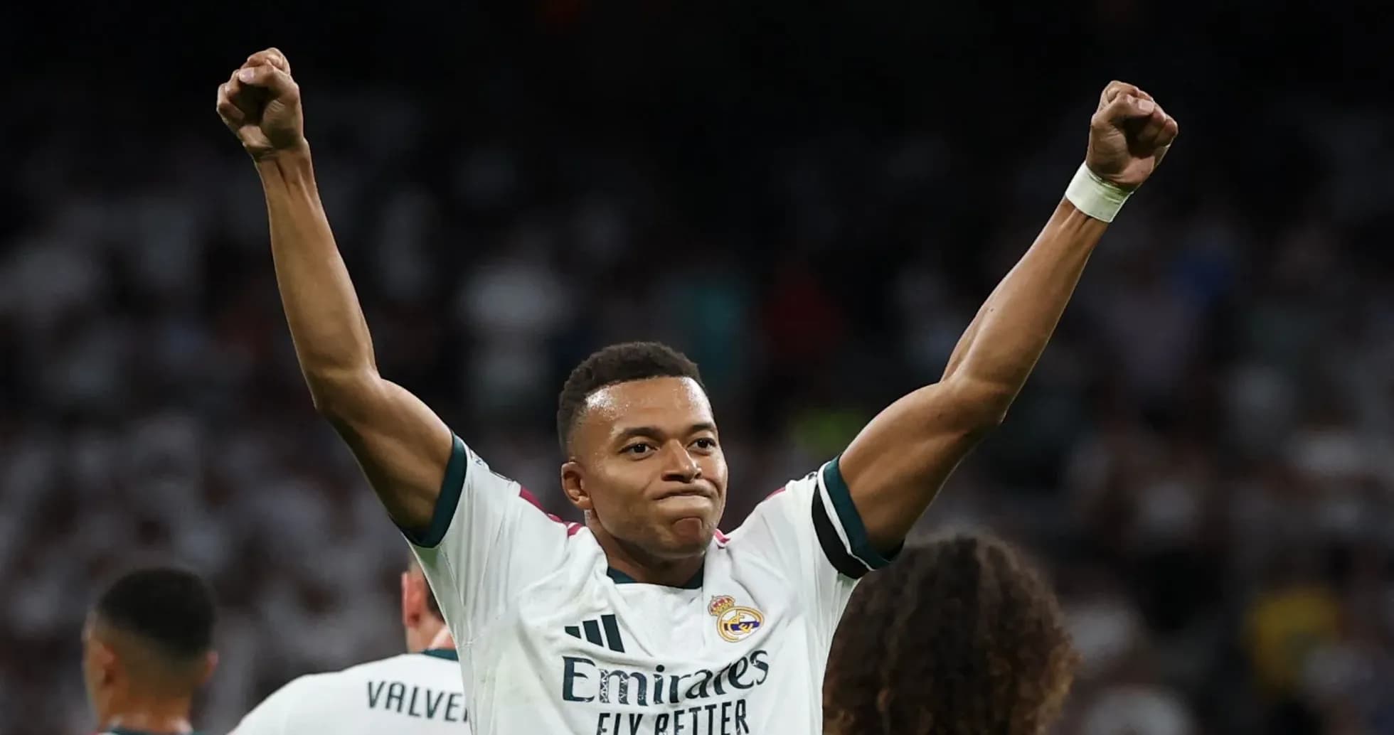 Player celebrating with raised arms after scoring
