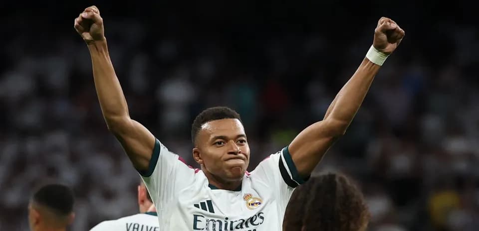 Player celebrating with raised arms after scoring