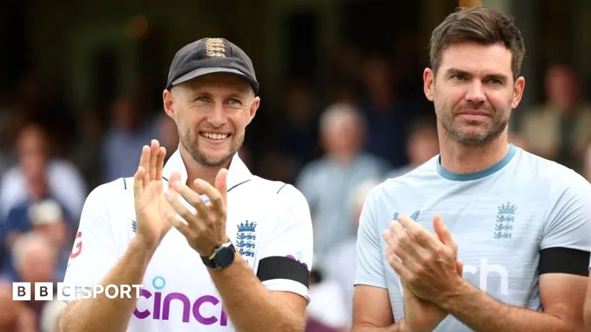 Two cricket players applauding on the field