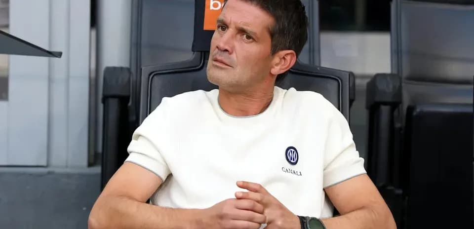 Coach sitting on bench during match observation
