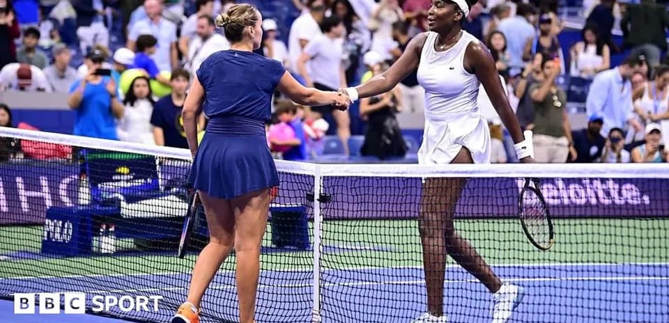 Two tennis players shaking hands at the net
