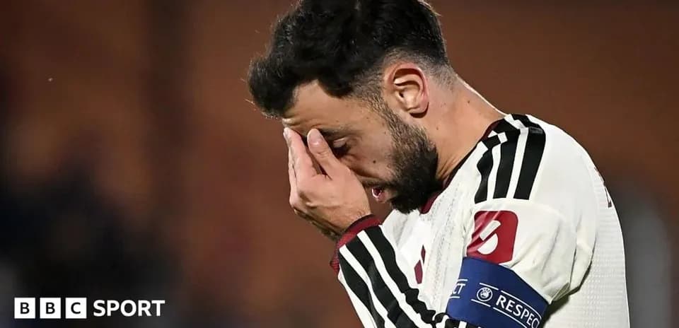 Player holding face in distress during match
