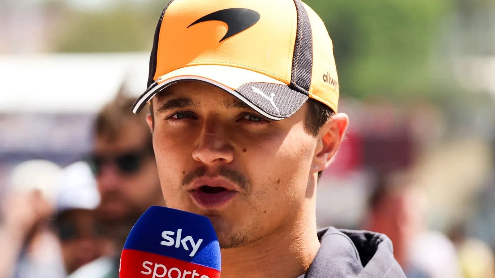 Driver speaking into microphone during interview