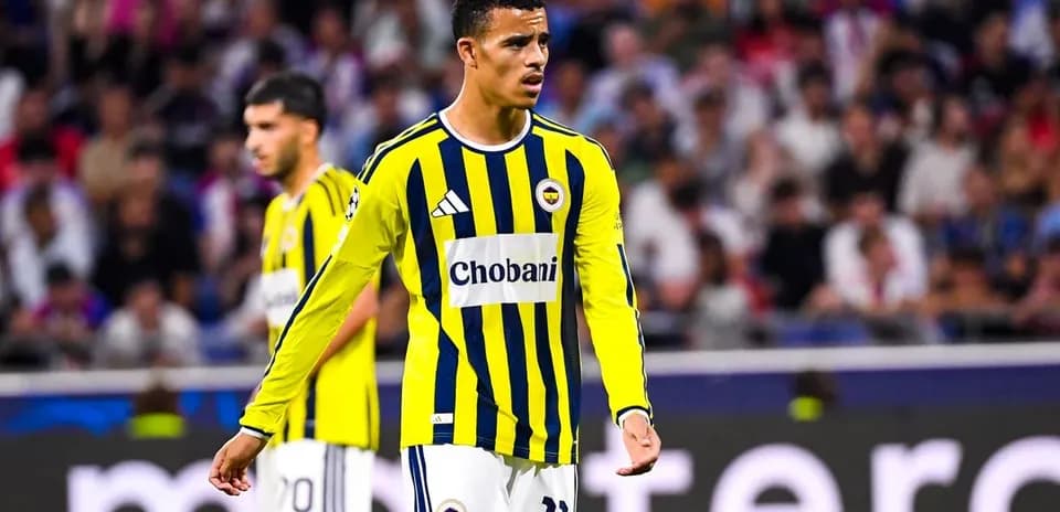 Fenerbahçe player during match with fans in background