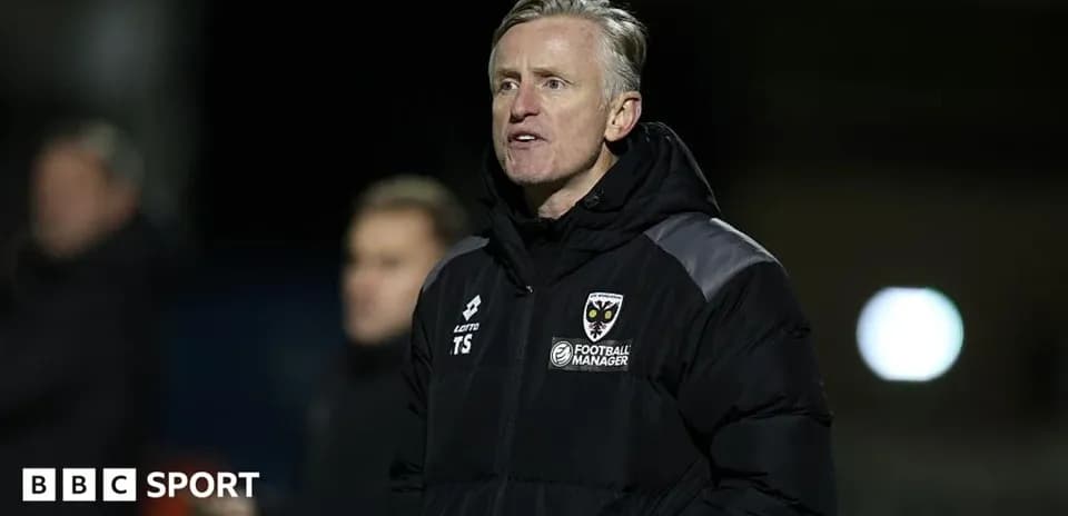 Manager speaking during a football match