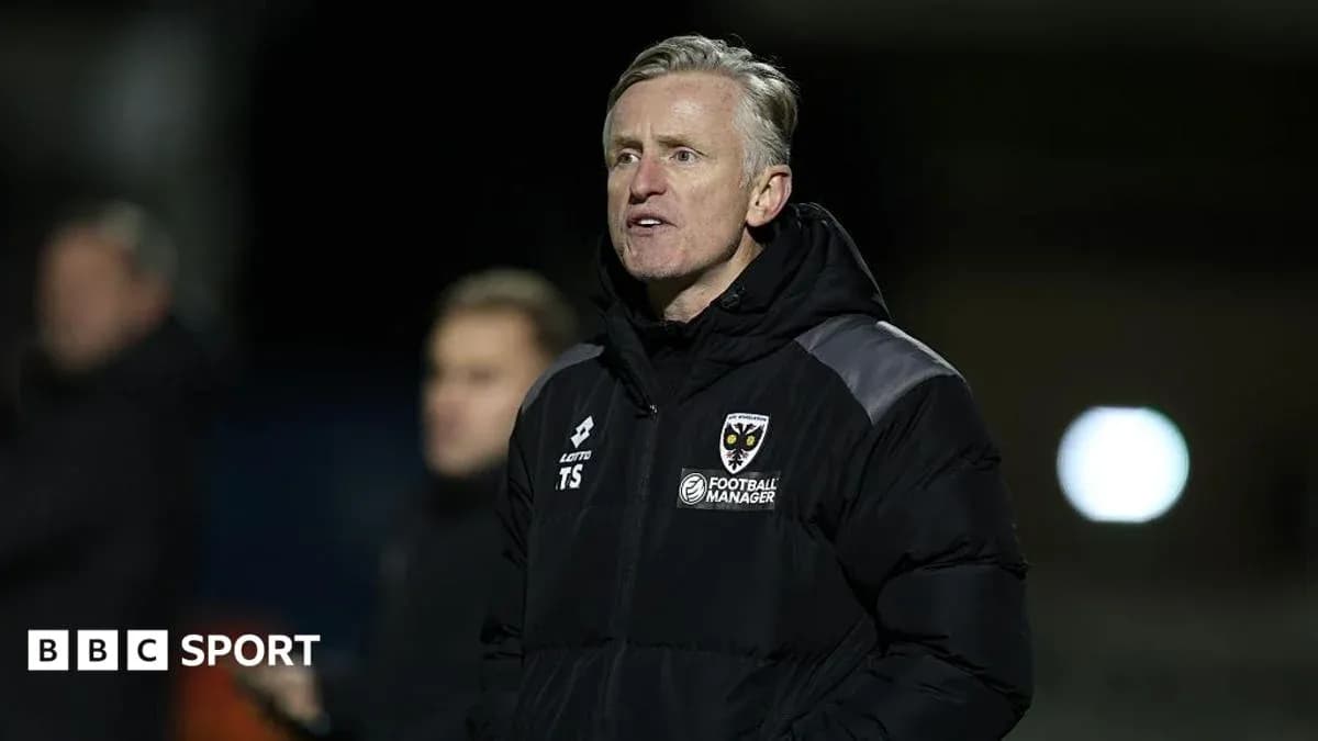 Manager speaking during a football match