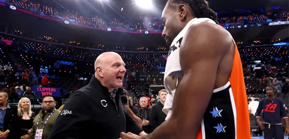 Kawhi Leonard and team owner celebrating post-game