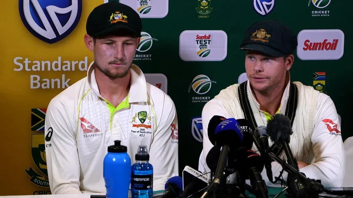 Australian cricketers at press conference with microphones