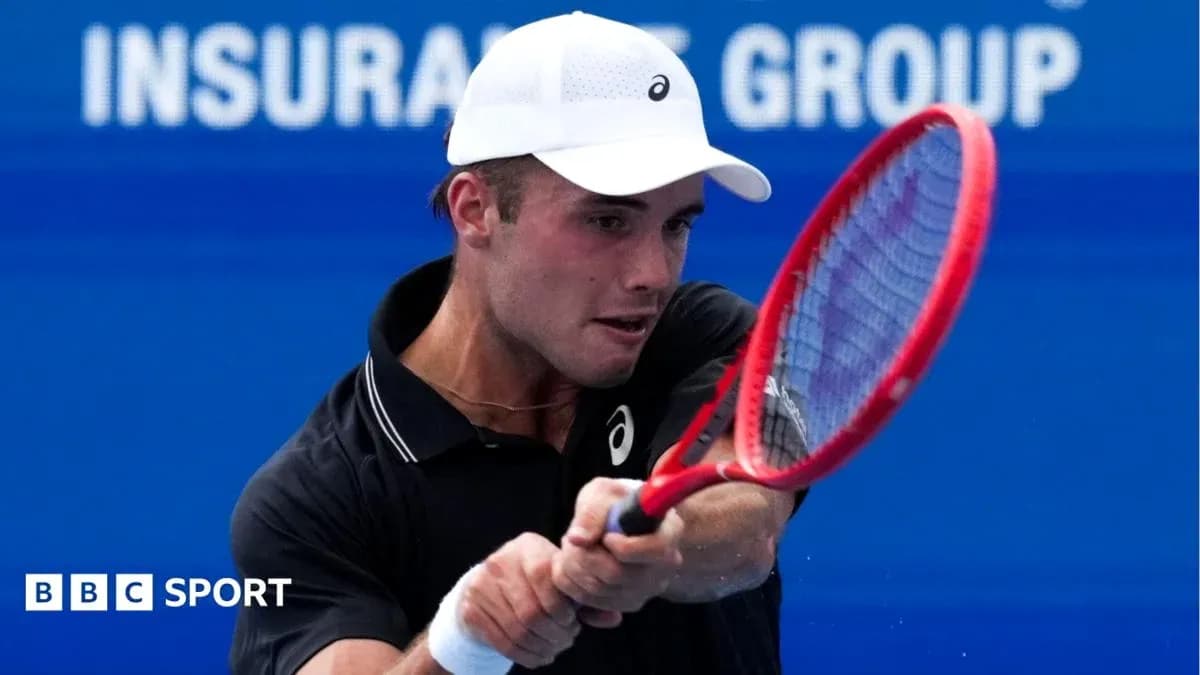 Tennis player hitting a forehand shot during match