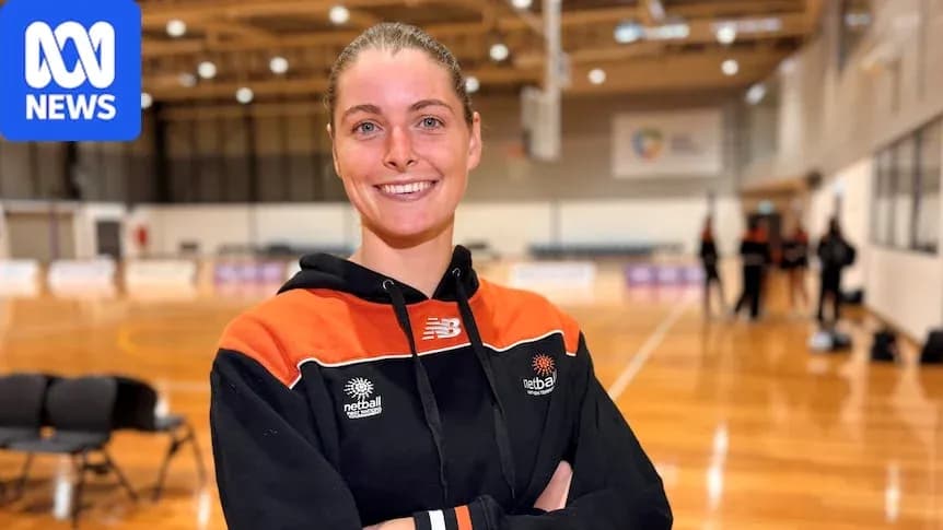 Netball player smiling in training facility