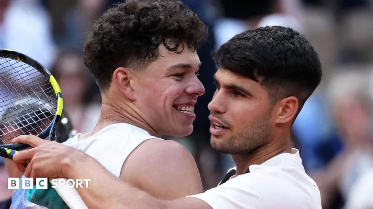 Two tennis players embracing after a match