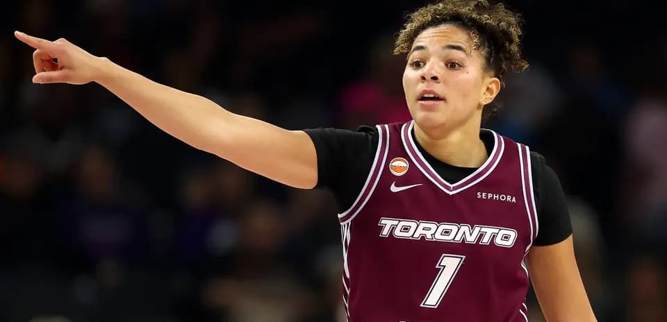 Player signaling during basketball game in Toronto jersey