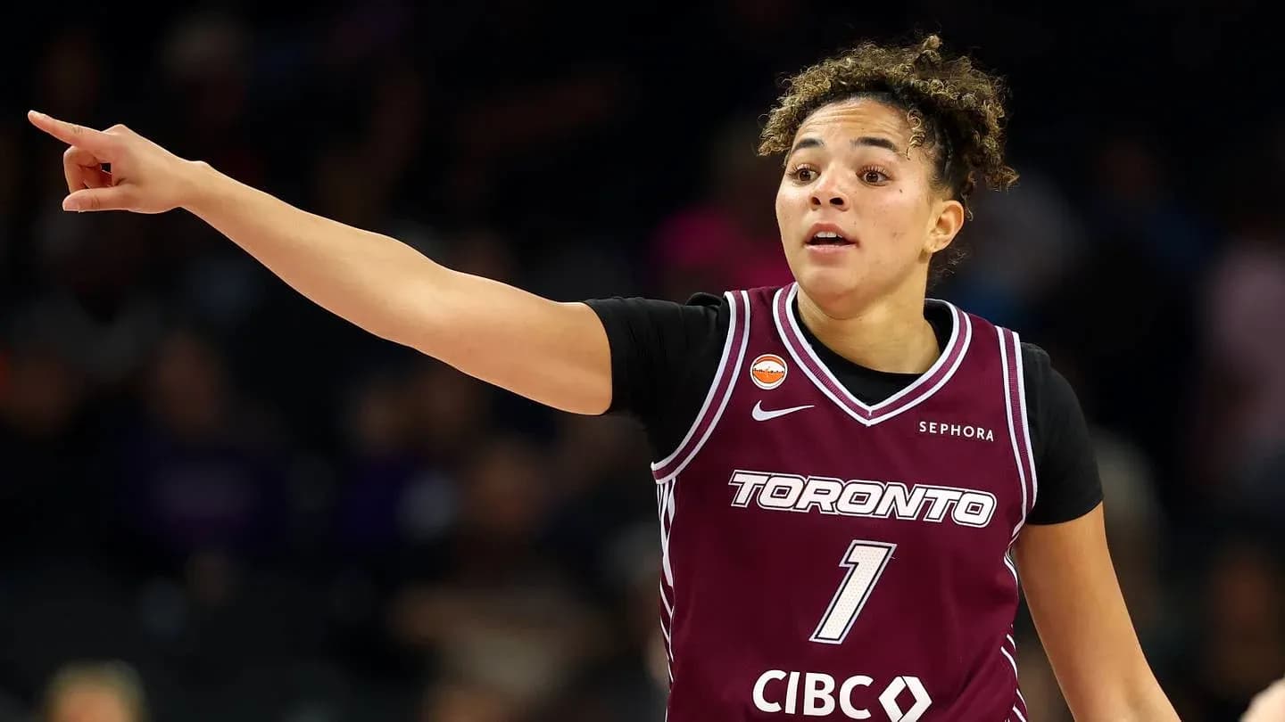 Player signaling during basketball game in Toronto jersey