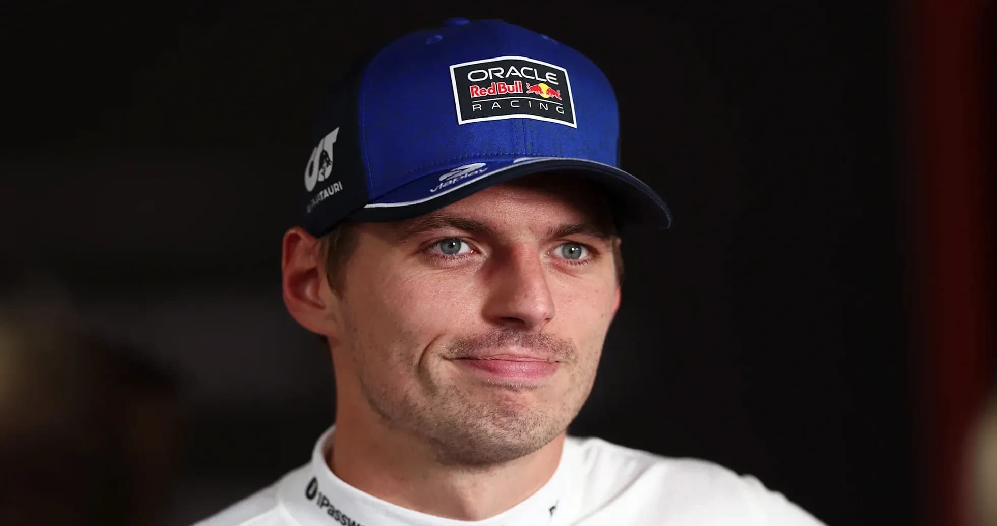 Driver wearing cap with Red Bull Racing logo
