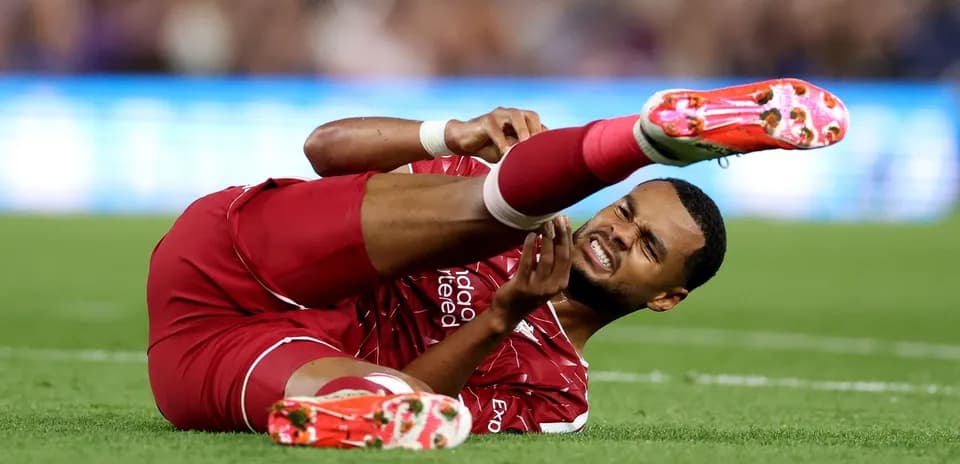Player lying on field with injured leg
