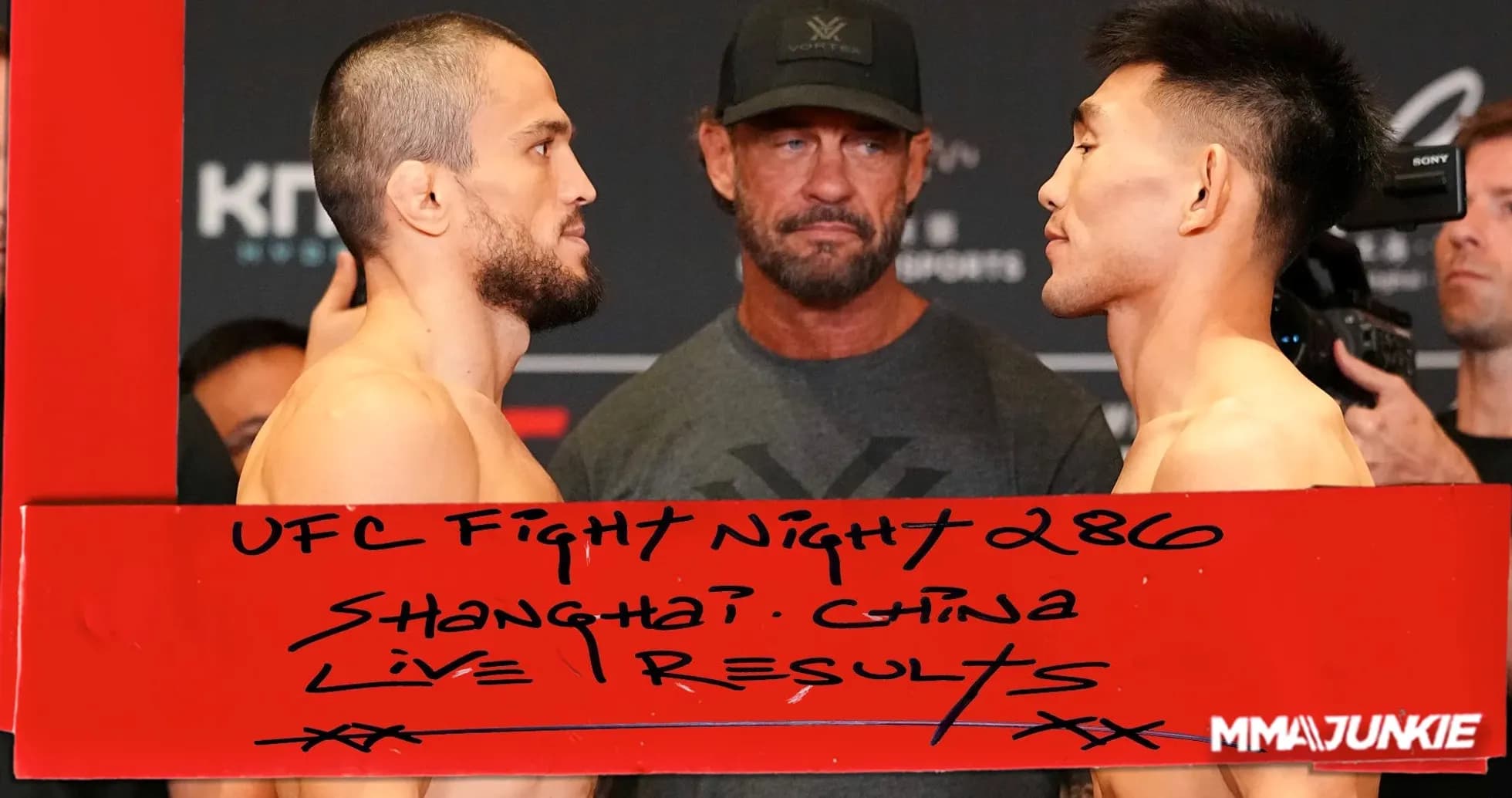 Two fighters facing each other at weigh-in event
