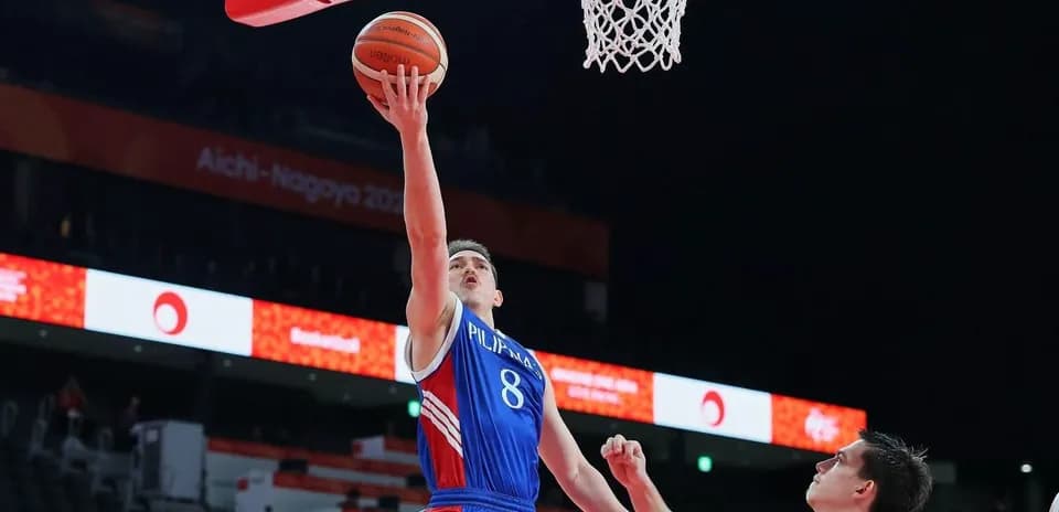 Player shooting a basketball near the hoop