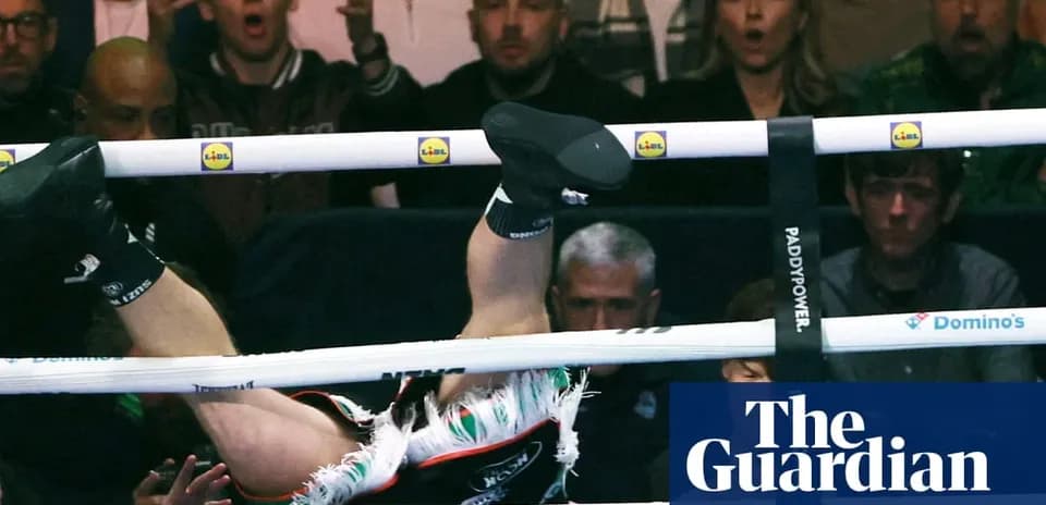 Boxer falling through ropes during match