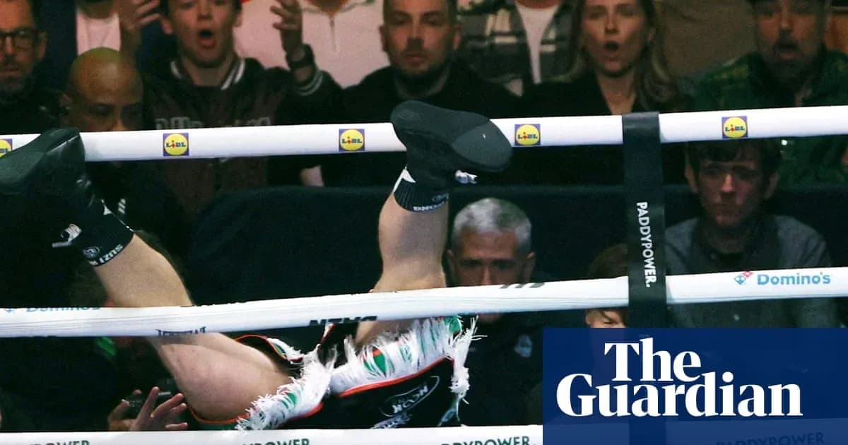 Boxer falling through ropes during match