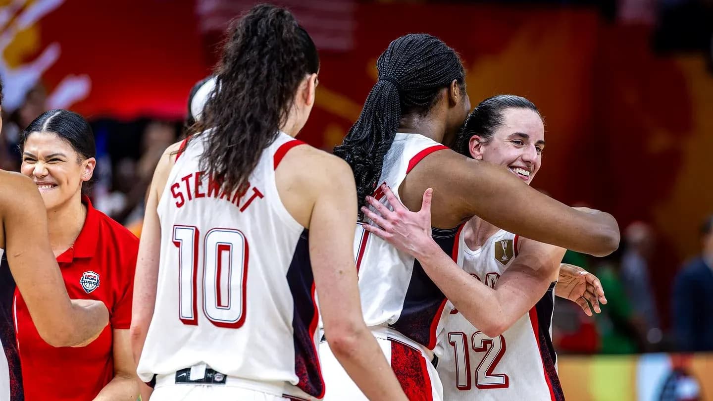 Players celebrating after a basketball match victory