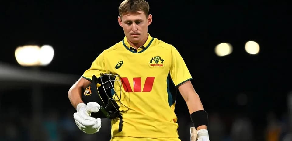 Australian cricketer walking off the field after dismissal