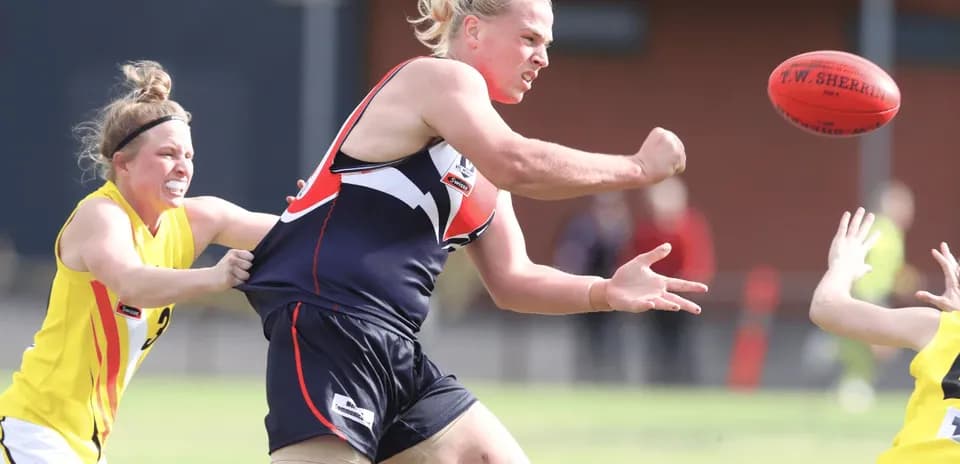 Player attempting to pass the ball in a match