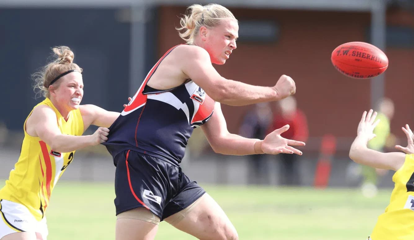 Player attempting to pass the ball in a match