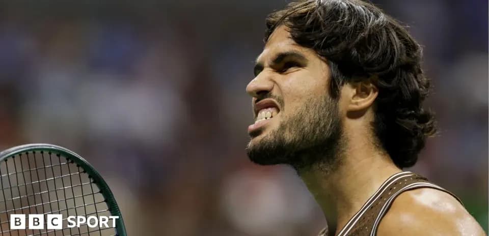 Tennis player reacting during a match with racket