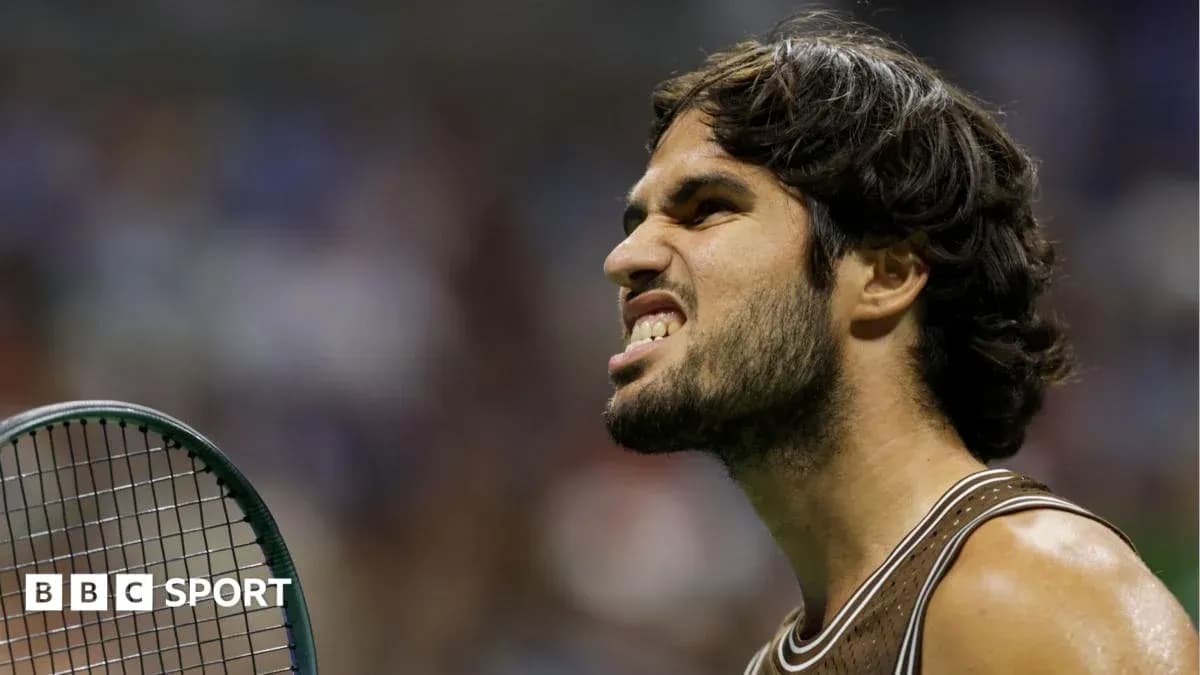 Tennis player reacting during a match with racket