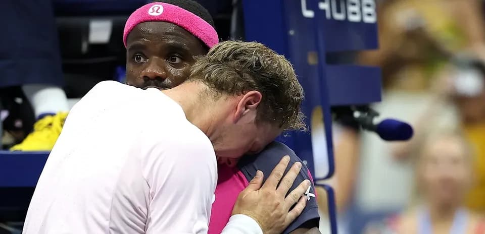 Players embracing during a tense moment on court
