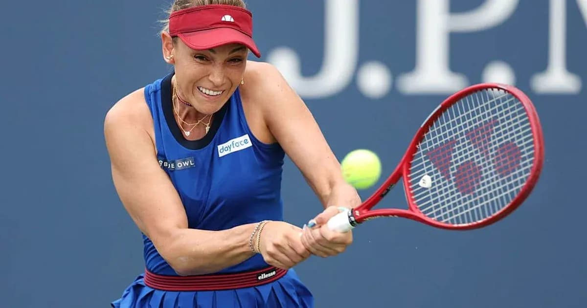 Player hitting tennis ball with racket during match