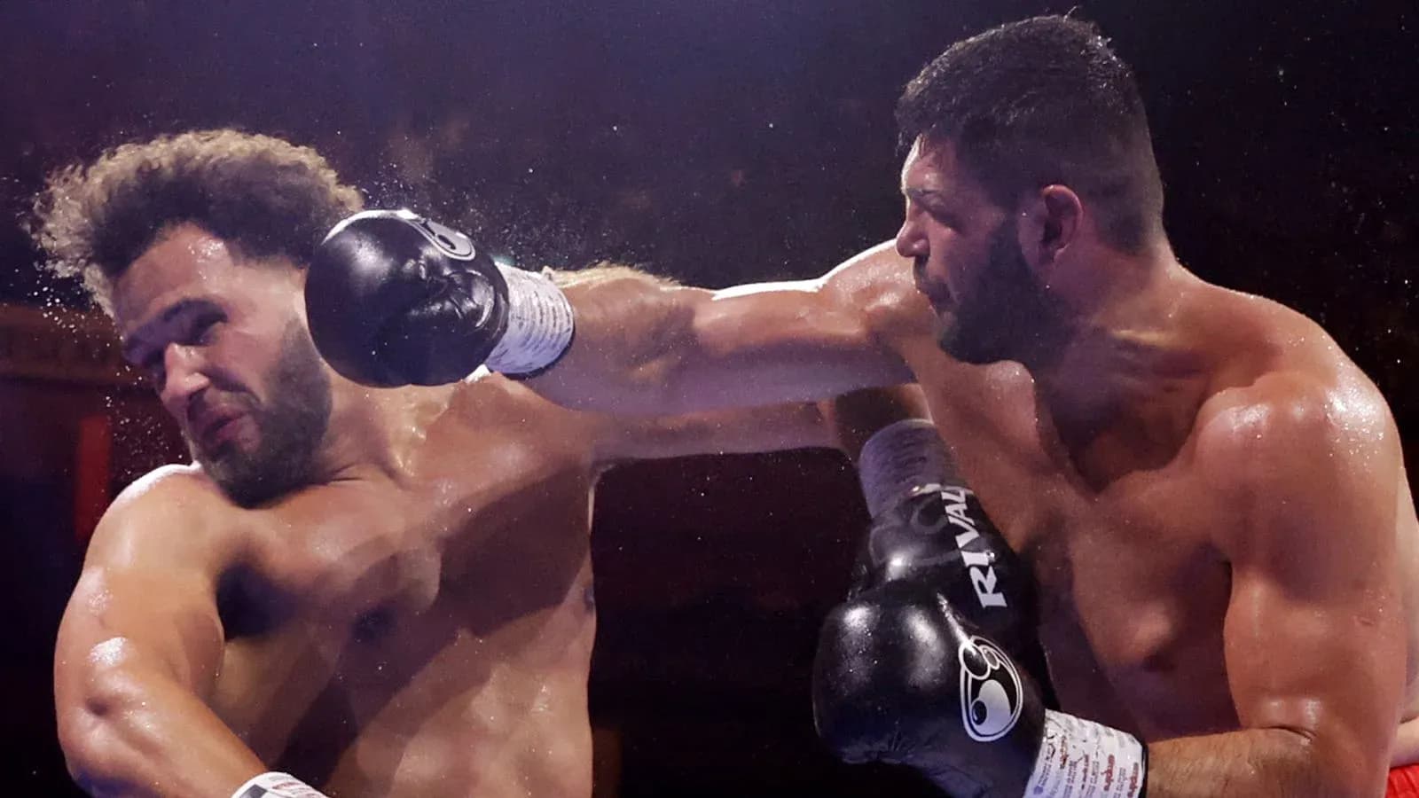 Boxers exchanging punches in the ring
