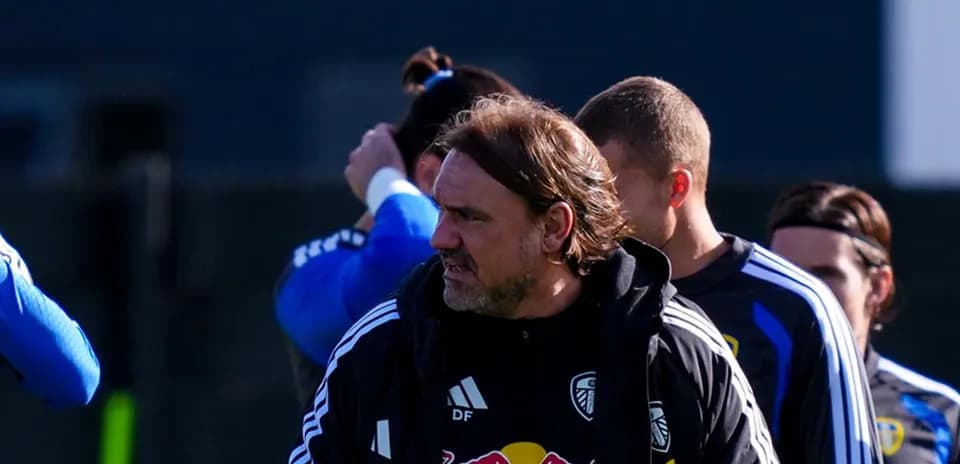 Coach leading training session with players