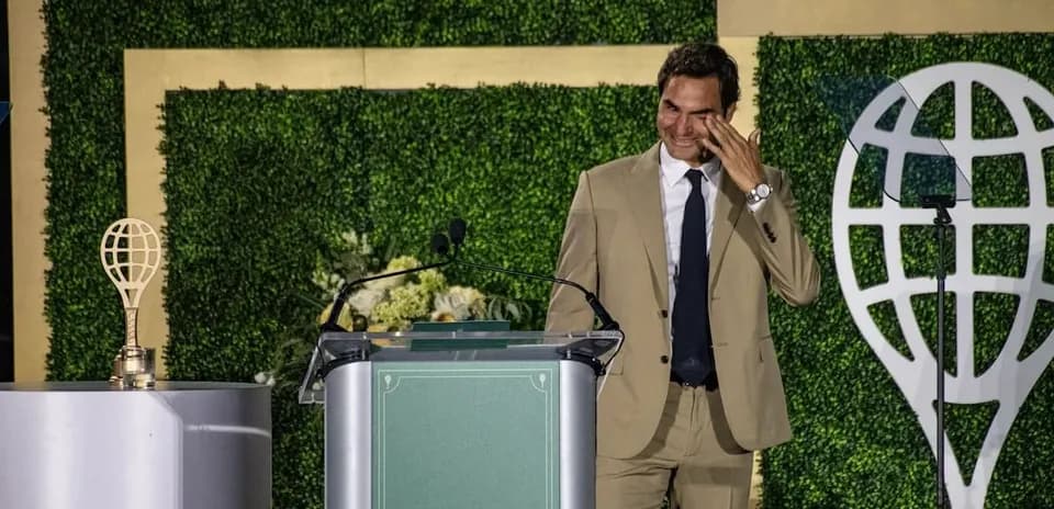 Roger Federer speaking at a podium during event