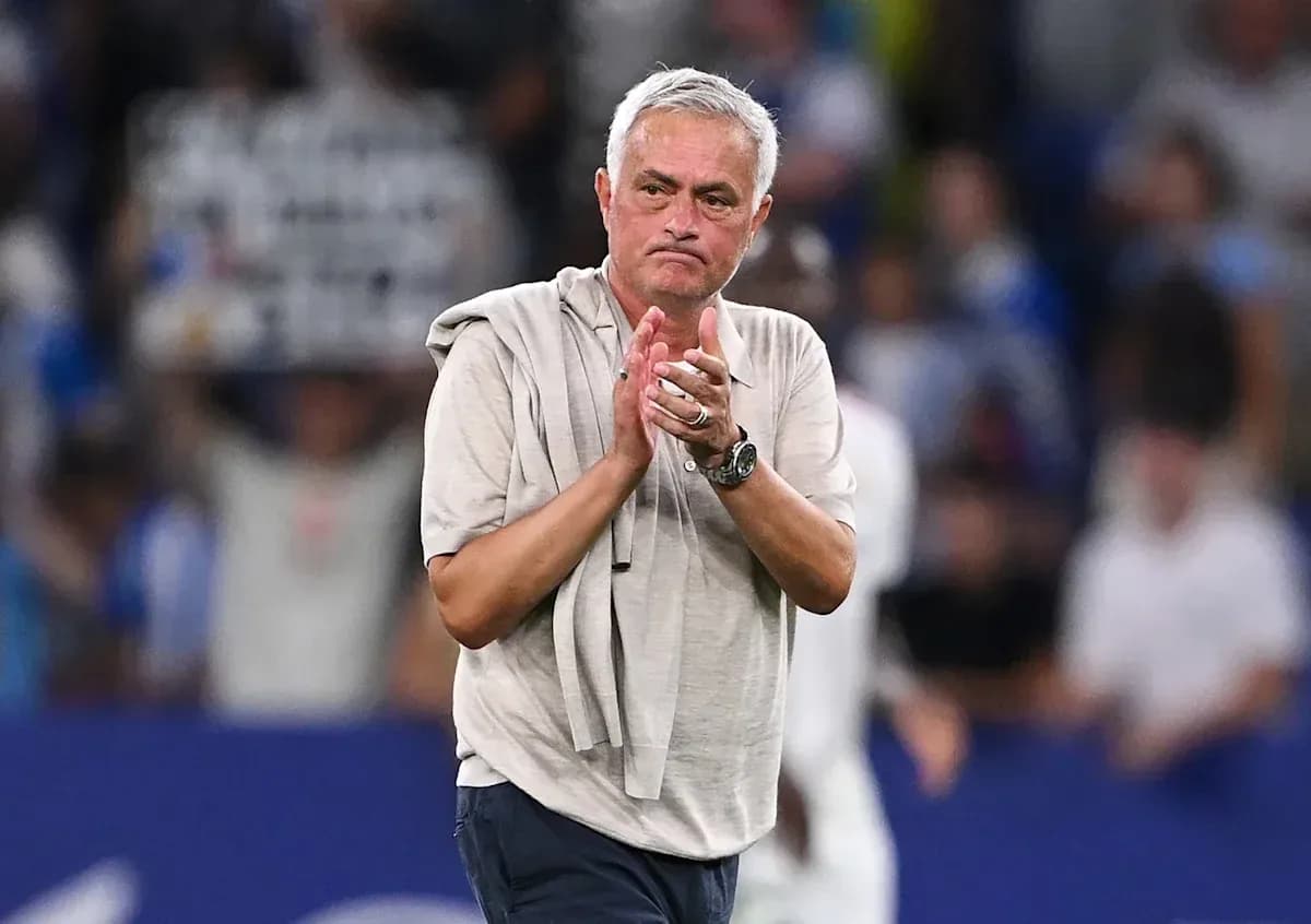 Manager applauding fans after the match