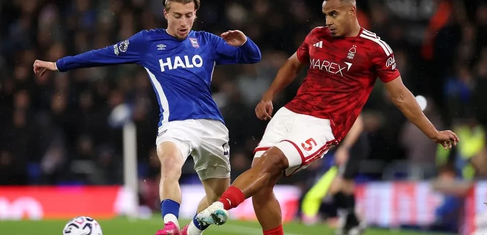 Two players contesting the ball during a match