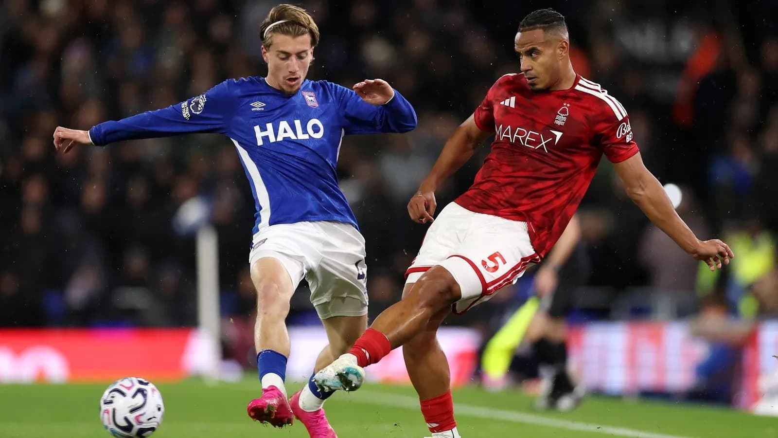 Two players contesting the ball during a match