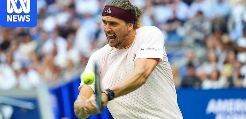 Player hitting tennis ball during match action