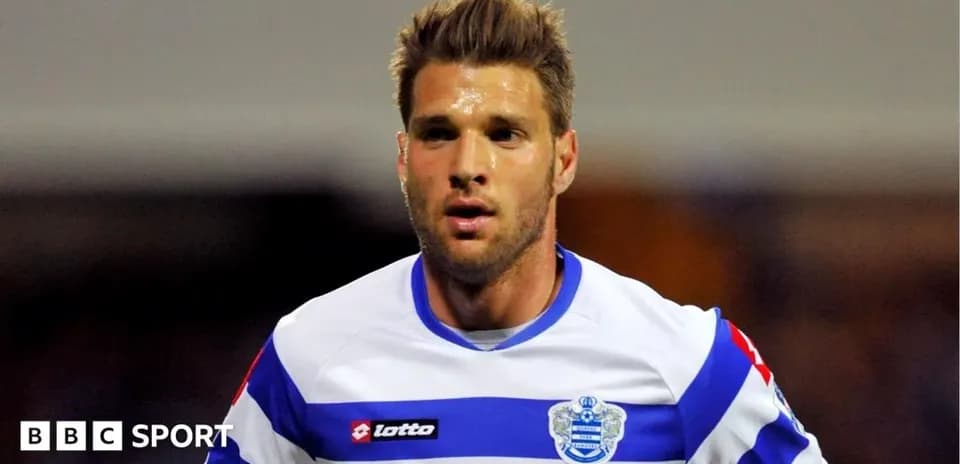 Player in QPR jersey during match action