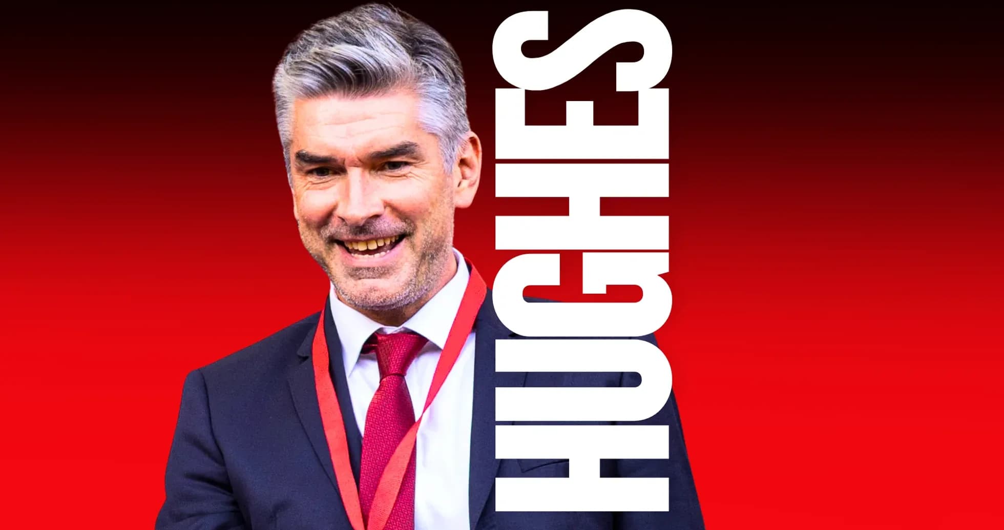 Man in suit smiling with a red background