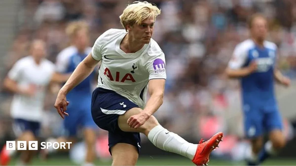 Tottenham player kicking ball during match