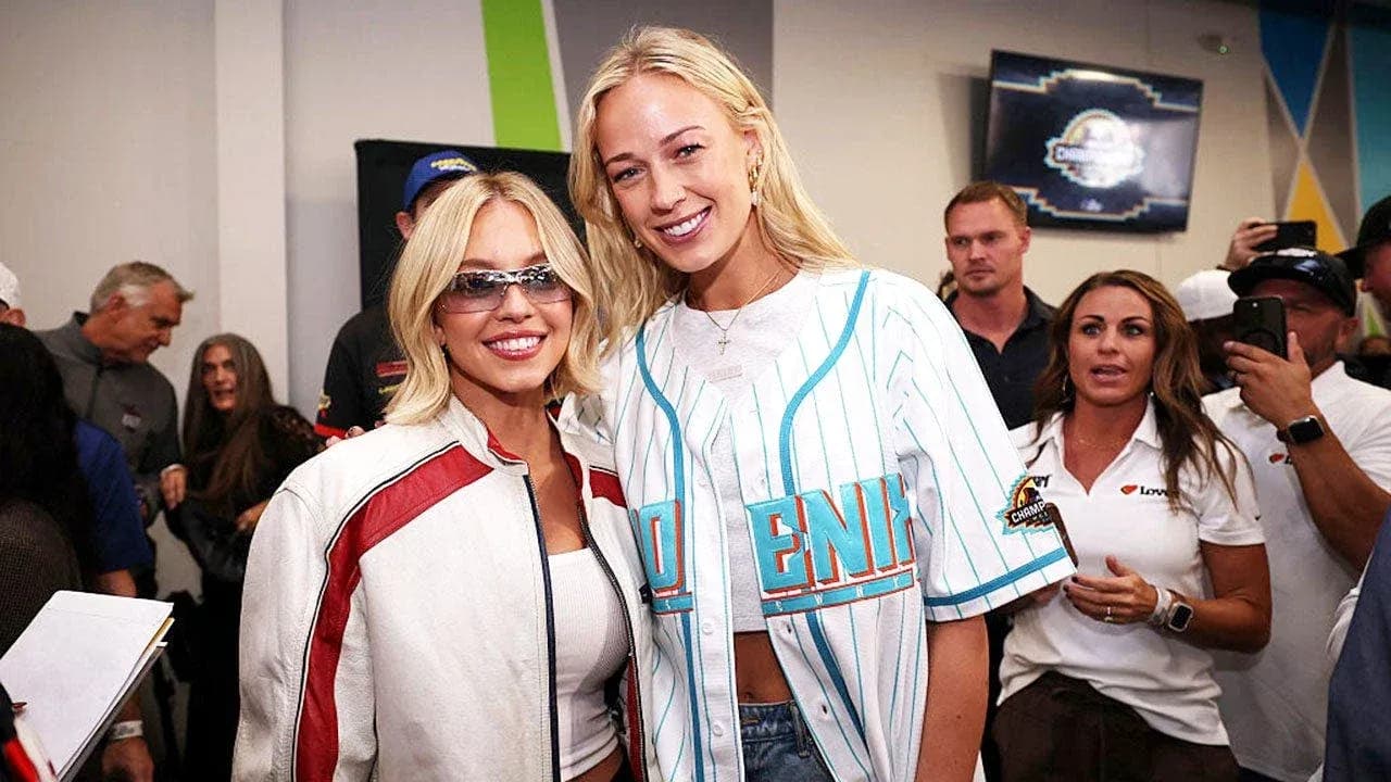 Two women posing together at an event